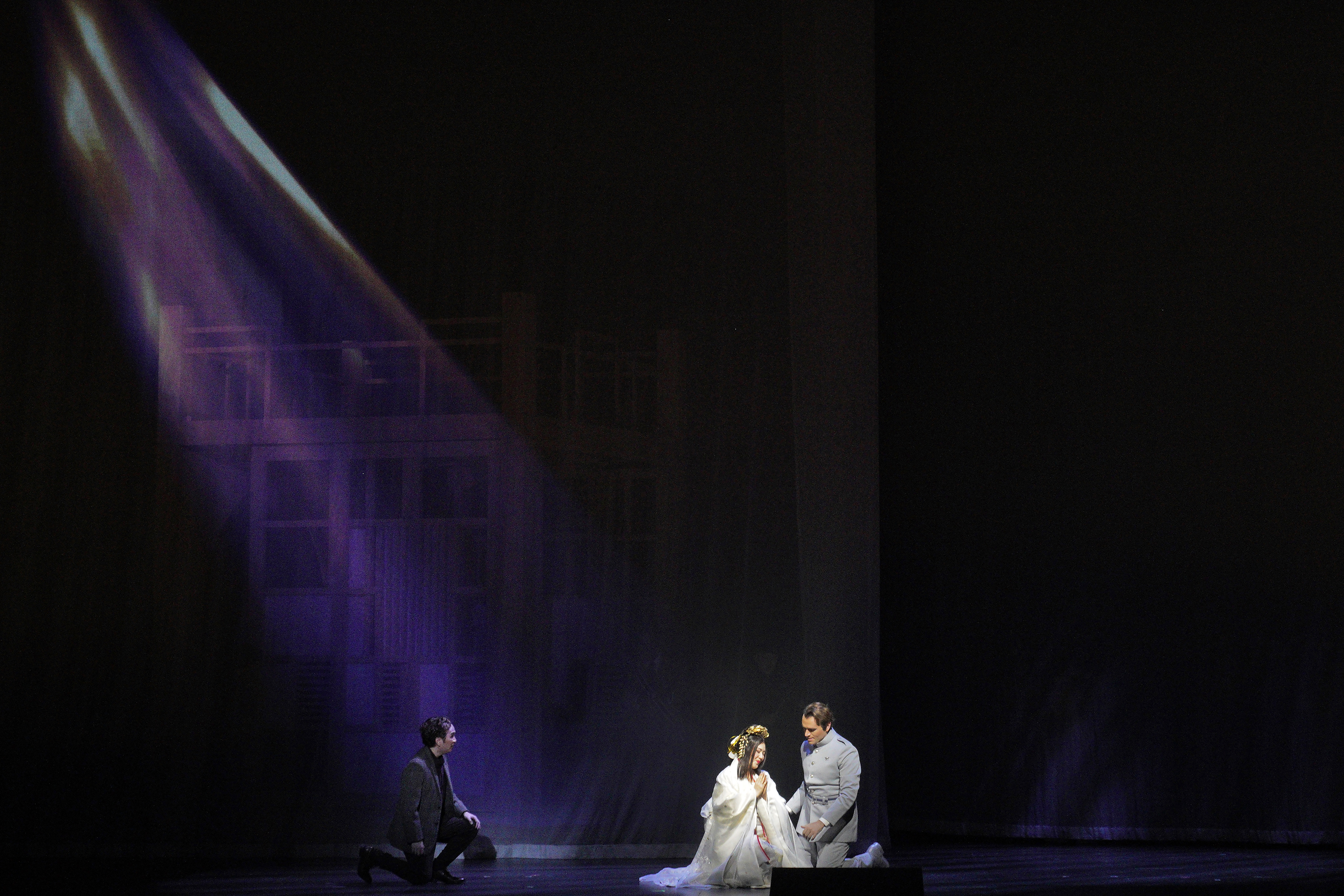 spotlight on madame butterfly with a man